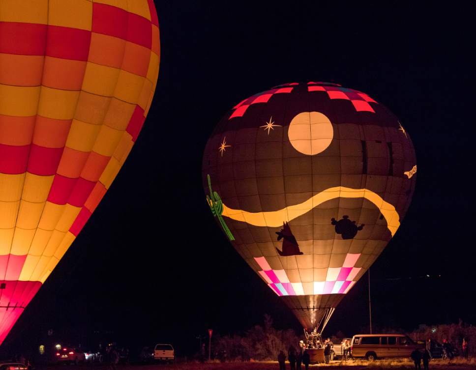Rick Egan  |  The Salt Lake Tribune

Balloons light up for the Glow-in during the Bluff Balloon Festival, Saturday, January 14, 2017.