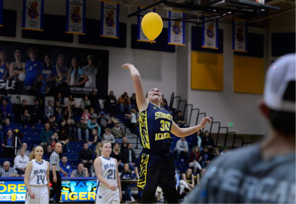 Scott Sommerdorf   |  The Salt Lake Tribune  
About the only fun Summit Academy had was dealing with this loose balloon that drifted down from the rafters. Summit was routed by Beaver 57-33, in a Class 2A girls' basketball playoff game played at Orem High, Friday, February 17, 2017.
