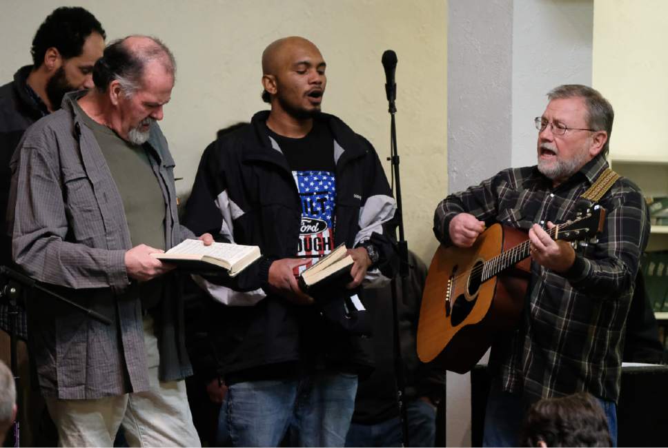 Francisco Kjolseth | The Salt Lake Tribune
Jack Marshall of Salt Lake Christian Center, right, joins men in singing songs during religious services at the Rescue Mission in Salt Lake on Thursday night, Feb. 2, 2017.