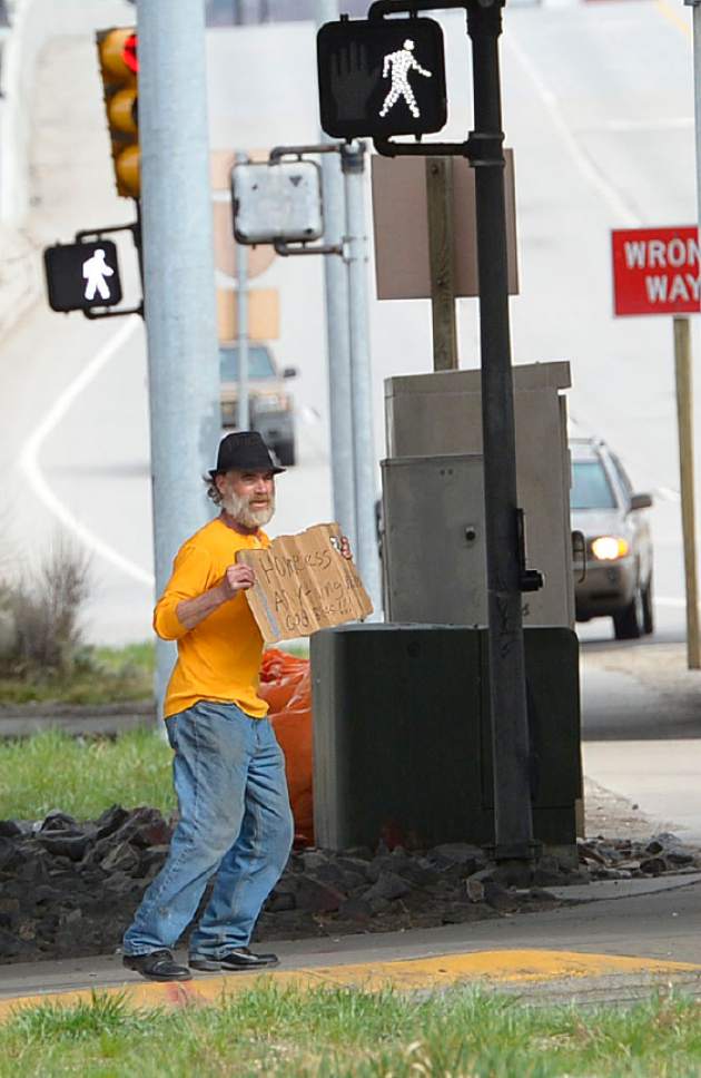 Leah Hogsten  |  The Salt Lake Tribune
"I think it's a good idea," said Lee McCashland of a bill to ban panhandling, while panhandling along 400 South. "99% of us out here are panhandling for drugs or alcohol," said McCashland who admits to panhandling to support his drug habit. The bill to ban panhandling along state highways, freeways and their shoulders passed the Utah Senate Senate, Thursday, March 6, 2014, with a vote of 27-1 and sent it to Gov. Gary Herbert for his signature. The House earlier passed it on a 51-22 vote. The measure does not attempt to prohibit such activities on a public sidewalk .