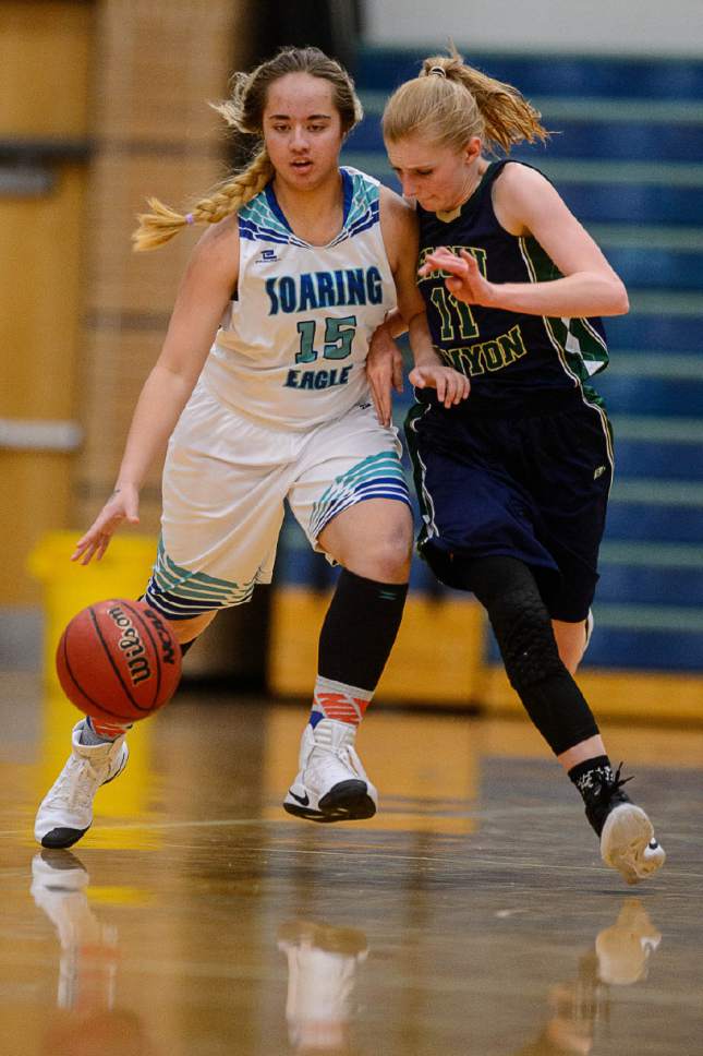 Trent Nelson  |  The Salt Lake Tribune
Juan Diego's Tepora Hannemann, defended by Snow Canyon's Hallie Remund as Juan Diego hosts Snow Canyon in a 3A playoff game, girls' high school basketball in Draper, Saturday February 18, 2017.