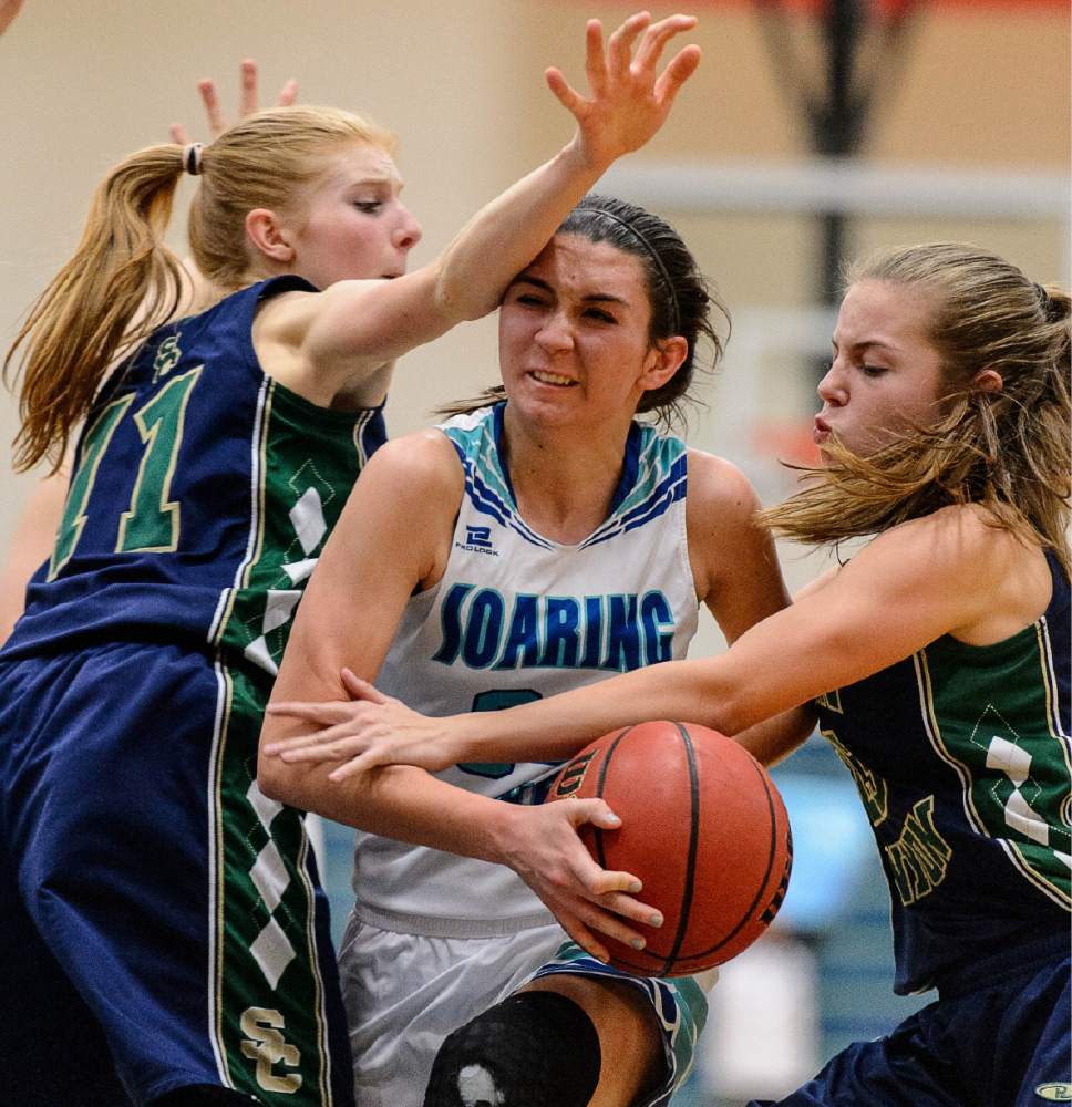 Trent Nelson  |  The Salt Lake Tribune
Snow Canyon's Hallie Remund, Juan Diego's Anna Ewoniuk and Snow Canyon's Olivia Harris, as Juan Diego hosts Snow Canyon in a 3A playoff game, girls' high school basketball in Draper, Saturday February 18, 2017.