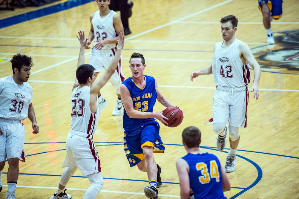 Chris Detrick  |  The Salt Lake Tribune
San Juan Jordan Blake (23) passes past Layton Christian Nicolas Aguirre (23) during the 2A play-off game at Orem High School Saturday February 18, 2017. Layton Christian defeated San Juan 81-63.