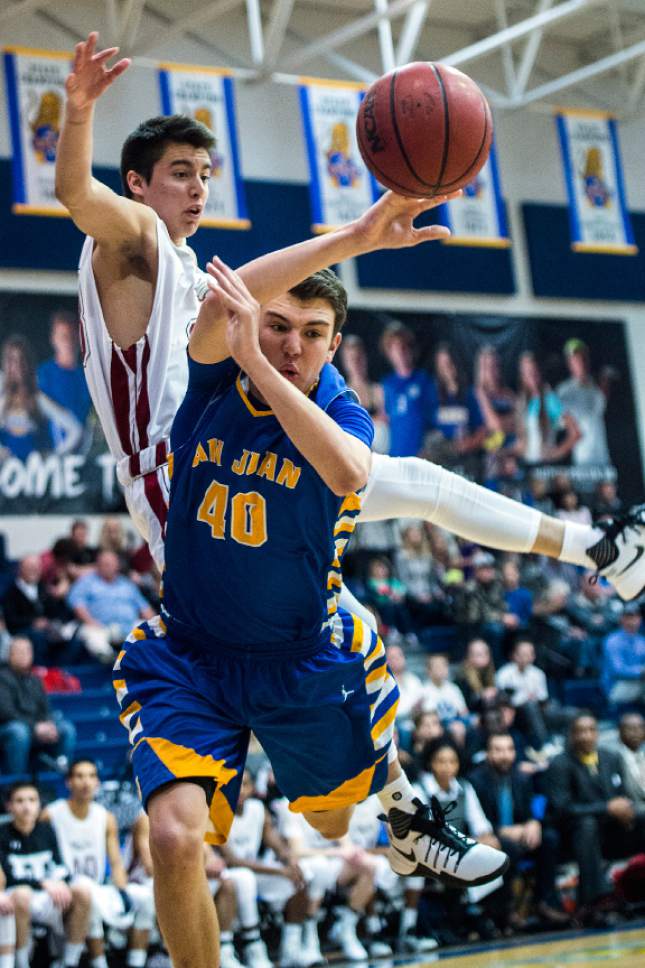 Chris Detrick  |  The Salt Lake Tribune
Layton Christian Nicolas Aguirre (23) fouls San Juan Jaden Torgerson (40) during the 2A play-off game at Orem High School Saturday February 18, 2017. Layton Christian defeated San Juan 81-63.