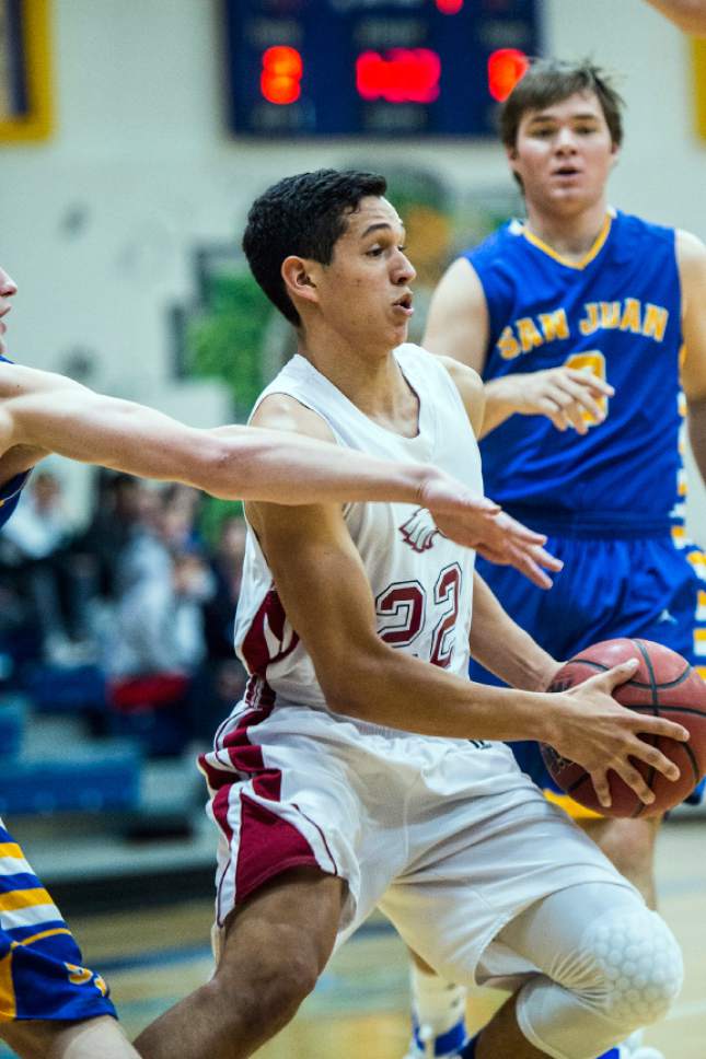 Chris Detrick  |  The Salt Lake Tribune
Layton Christian Christians Gutierrez (22) runs past San Juan Dylan Ivins (3) and San Juan Landen Pemberton (2) during the 2A play-off game at Orem High School Saturday February 18, 2017. Layton Christian defeated San Juan 81-63.