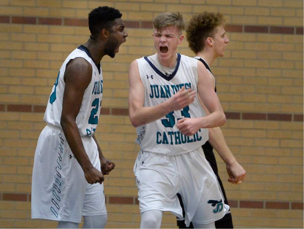 Scott Sommerdorf   |  The Salt Lake Tribune  
Juan Diego's Jason Ricketts, left, and Brennan Fabry yell as they celebrate a physical play under the hoop to score during second half play. Juan Diego defeated Pine View 47-42 in a boys 3A playoff, Friday, February 17, 2017.