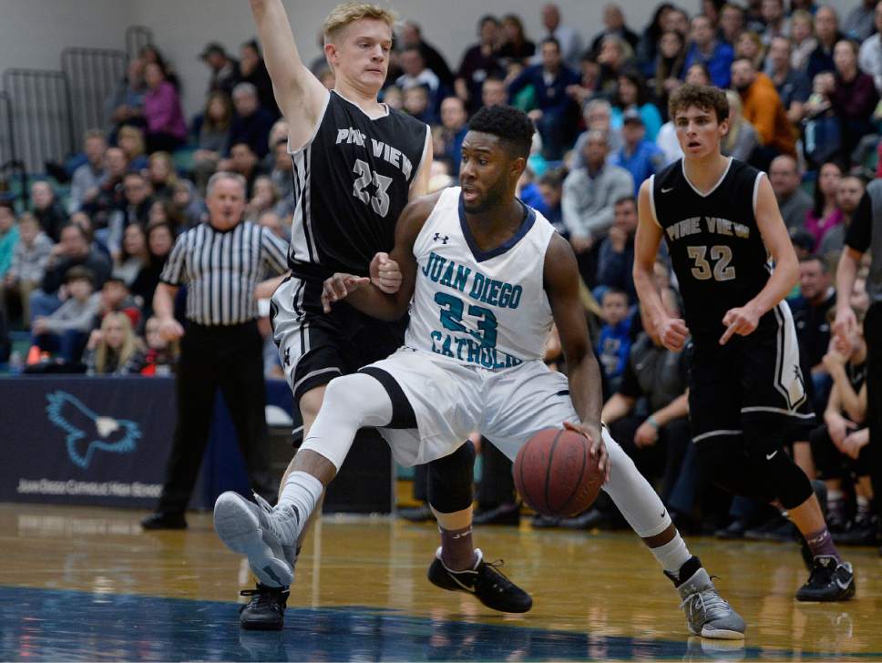 Scott Sommerdorf   |  The Salt Lake Tribune  
Juan Diego's Jason Ricketts drives against his opposite number, Pine View's Jackson Wadsworth during first half play. Juan Diego defeated Pine View 47-42 in a boys 3A playoff, Friday, February 17, 2017.