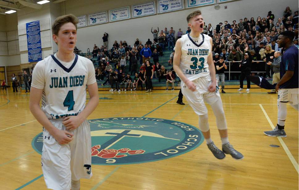 Scott Sommerdorf   |  The Salt Lake Tribune  
JD Ahlstrom, left, and Brennan Fabry celebrate Juan Diego's 47-42 win over Pine View in a boys 3A playoff, Friday, February 17, 2017.