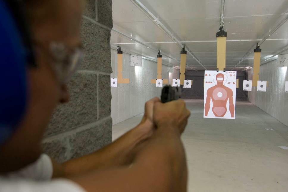 Tribune File Photo
A shooter at Doug's Shoot N Sport's gun range takes aim at a human shaped target.