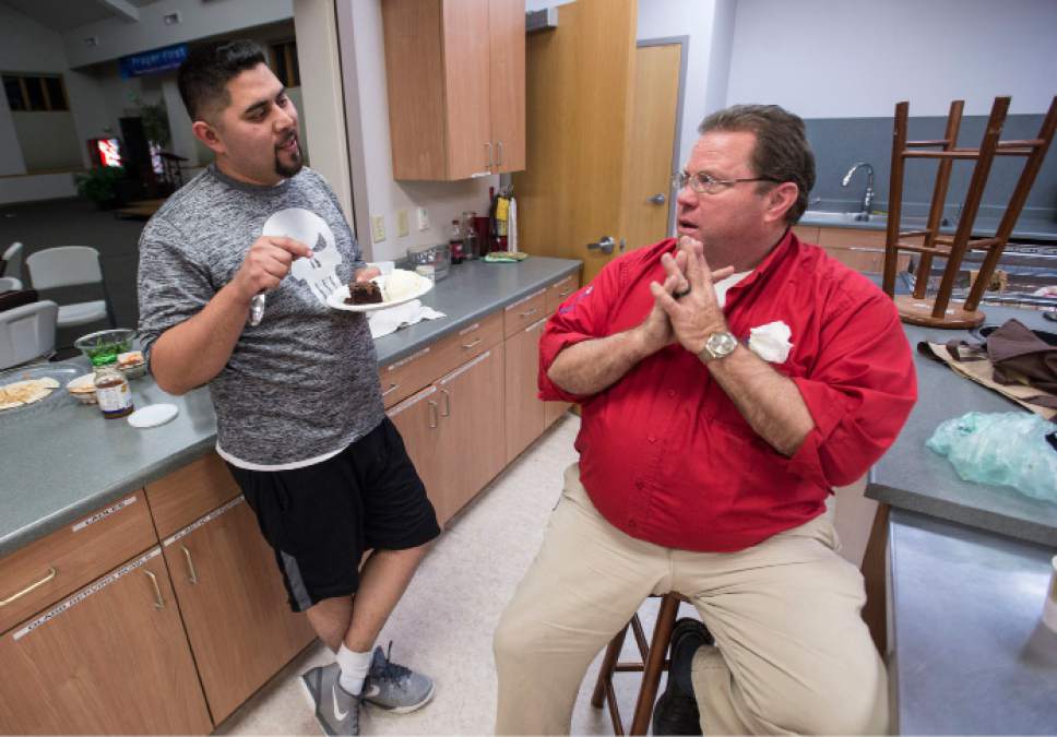 Steve Griffin  |  The Salt Lake Tribune

Javier Tinajero, left, talks with Steve Fredine of Good Shepherd Lutheran Church as he enjoys dessert after dinner in Sandy, Utah, Tuesday, Jan. 31, 2017. Many area churches are involved with Family Promise in which various churches house up to homeless families at their meetinghouses for a week. Lots of volunteers help provide the meals and help take care of the residents. Tinajero and his family of four are staying at the church while they await permanent housing.