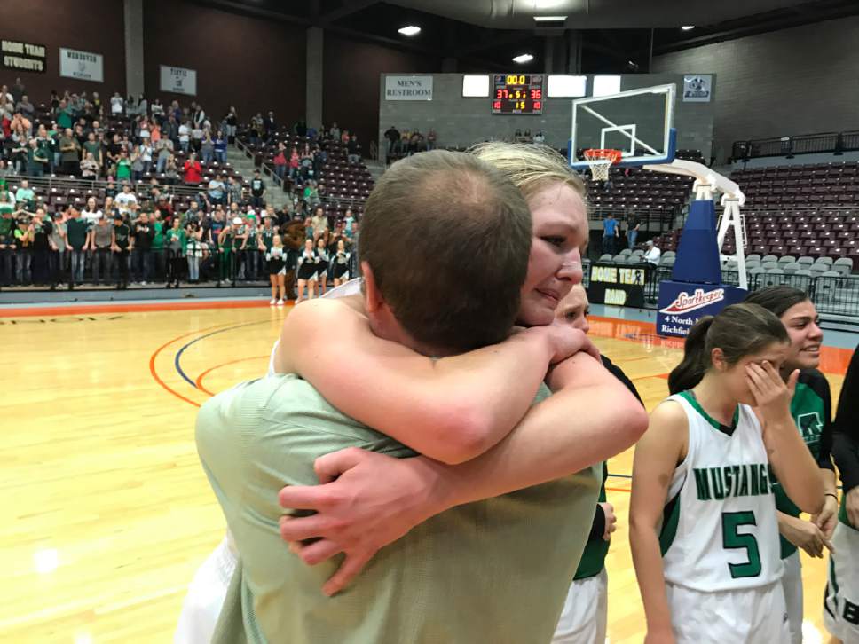 Trevor Phibbs  |  Salt Lake Tribune

Bryce Valley girls' basketball coach Tyson Brinkerhoff hugs his daughter Danielle after Bryce Valley won the Class 1A state title Saturday at the Sevier Valley Center in Richfield.