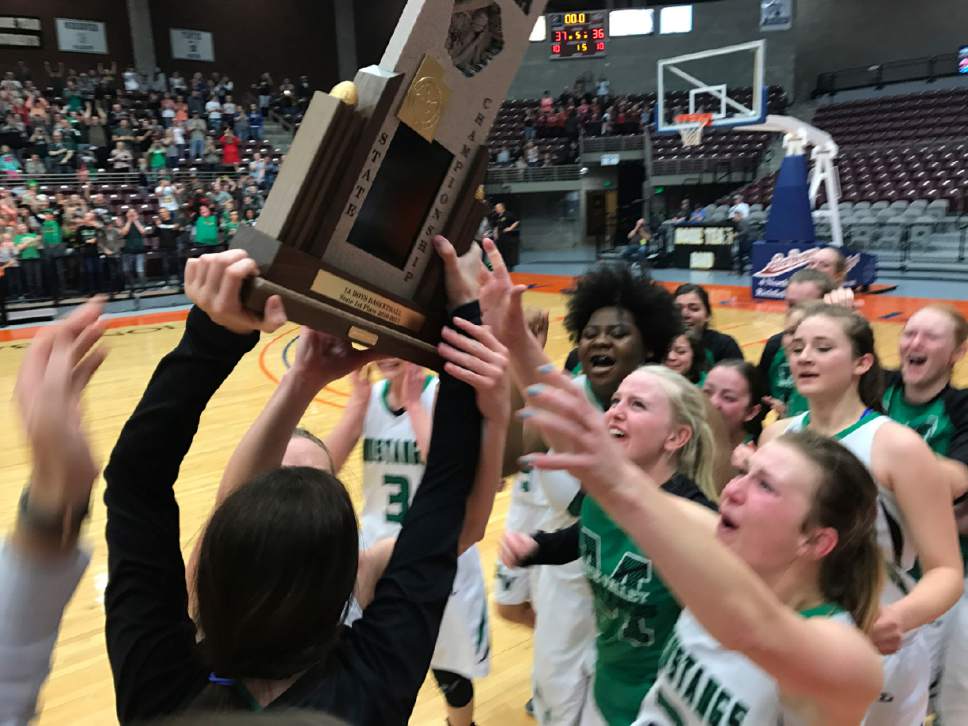 Trevor Phibbs  |  Salt Lake Tribune

The Bryce Valley girls' basketball team celebrates its first state championship in school history after defeating Tabiona 37-36 in overtime Saturday at the Sevier Valley Center in Richfield.