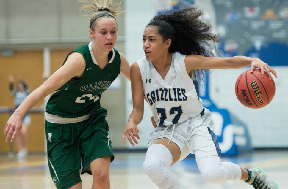 Rick Egan  |  The Salt Lake Tribune

Eleyana Tafisi  (22) Copper Hills, takes the ball inside, as Amber Marshall (24) Clearfield defends, in 5A girls basketball playoff action, Clearfield vs. Copper Hills, Monday, February 20, 2017.