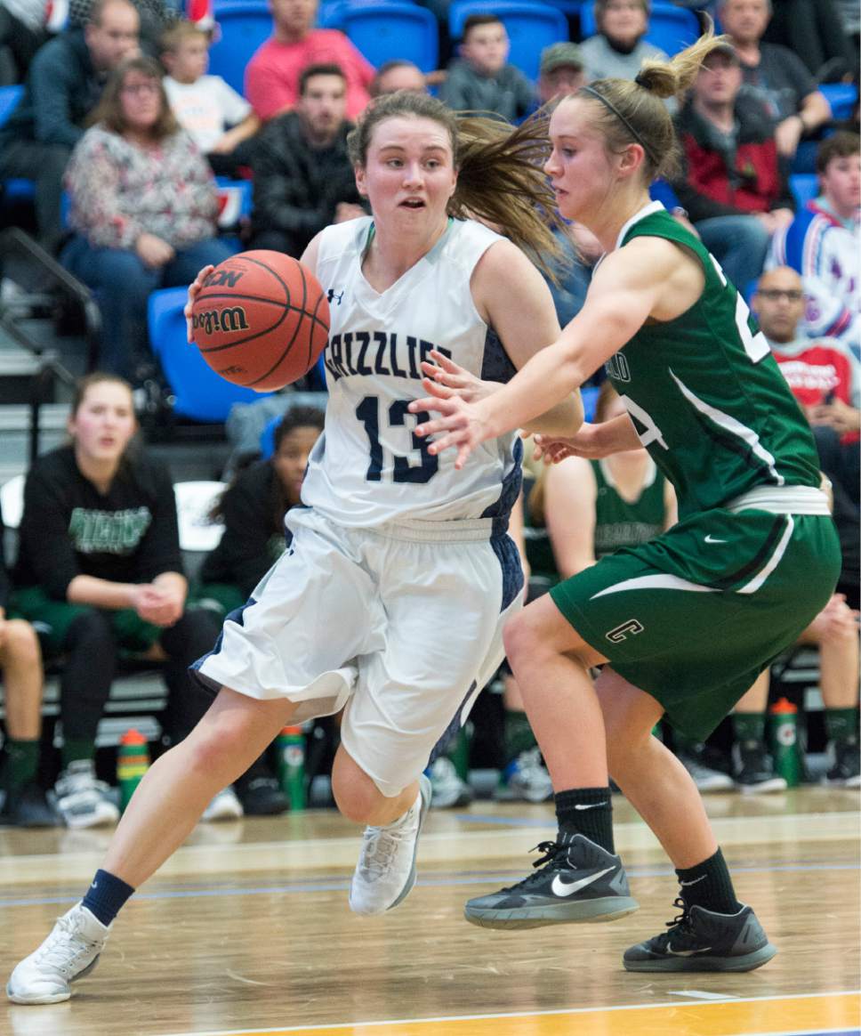 Rick Egan  |  The Salt Lake Tribune

Kate Sisler (13) Copper Hills, takes the ball inside as in 5A girls basketball playoff action, Clearfield vs. Copper Hills, Monday, February 20, 2017.