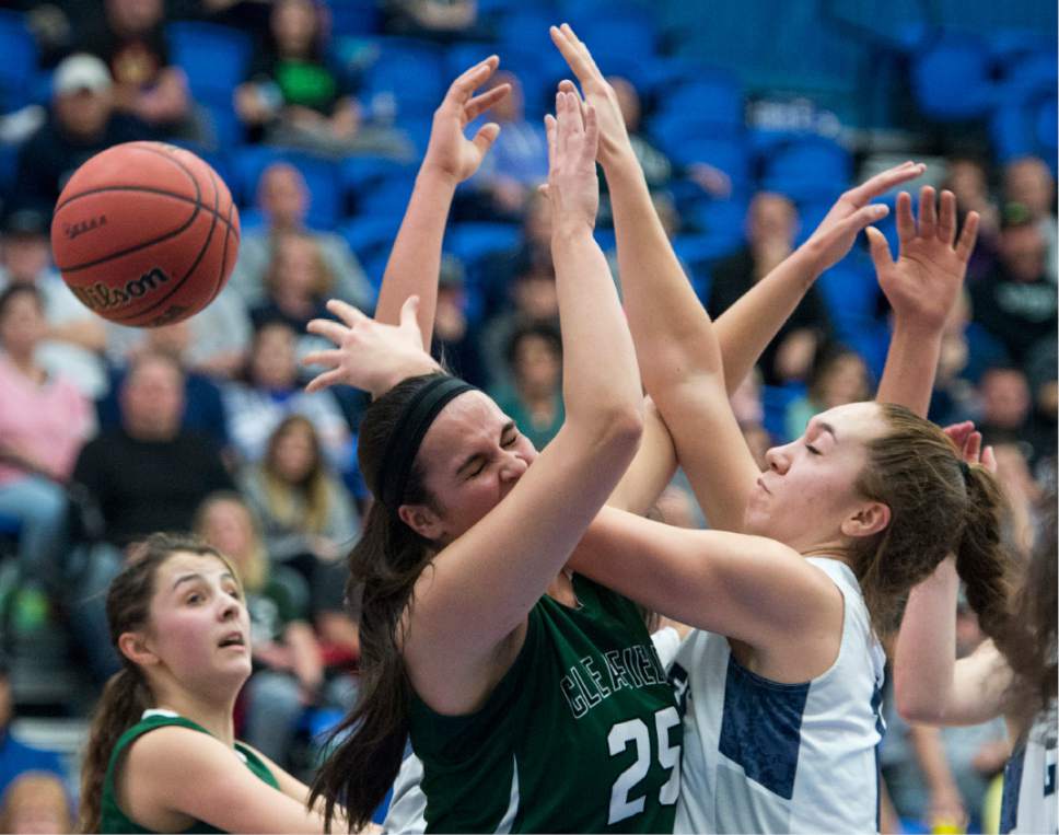 Rick Egan  |  The Salt Lake Tribune

Taela Laufiso (12) Copper Hills, runs into Rachel Watson (25) Clearfield defends, in 5A girls basketball playoff action, Clearfield vs. Copper Hills, Monday, February 20, 2017.