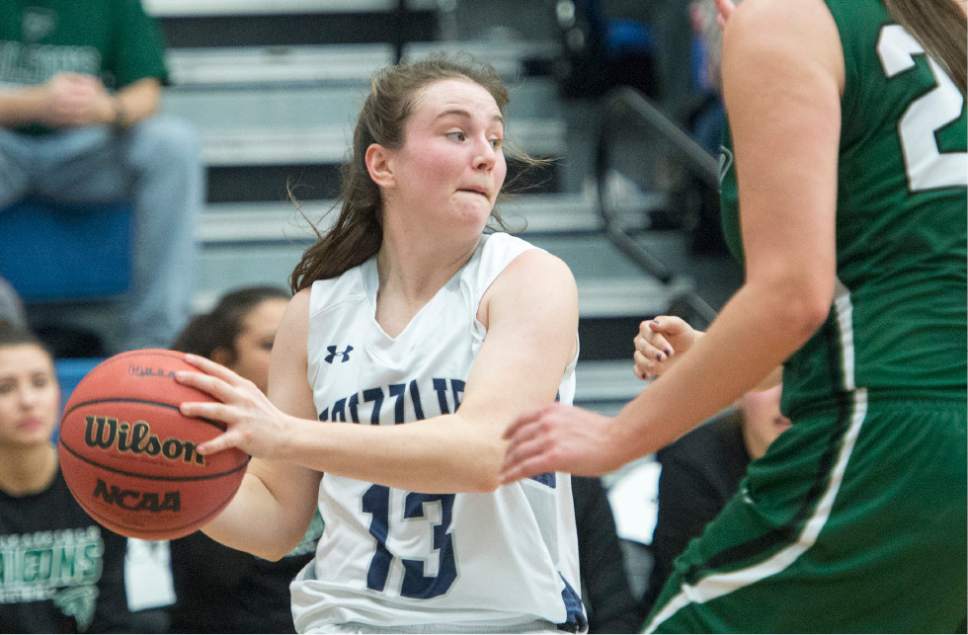 Rick Egan  |  The Salt Lake Tribune

Kate Sisler (13) Copper Hills, looks to pass, in 5A girls basketball playoff action, Clearfield vs. Copper Hills, Monday, February 20, 2017.