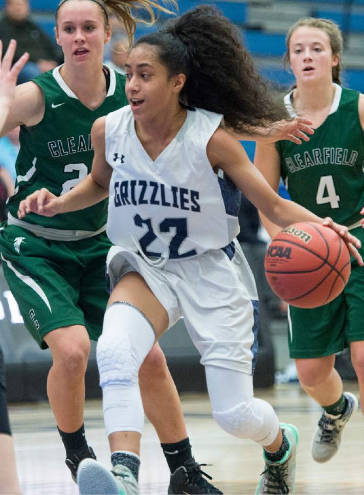 Rick Egan  |  The Salt Lake Tribune

Eleyana Tafisi  (22) Copper Hills, takes the ball inside, as Amber Marshall (24) Clearfield defends, in 5A girls basketball playoff action, Clearfield vs. Copper Hills, Monday, February 20, 2017.