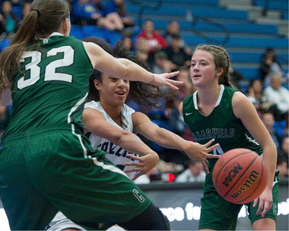 Rick Egan  |  The Salt Lake Tribune

Eleyana Tafisi  (22) Copper Hills, gets a pass off, as Kiersten Boyack (32) and Sydnee Cervinski (4) defend for Clearfield, in  5A basketball action, Clearfield vs. Copper Hills, Monday, February 20, 2017.
