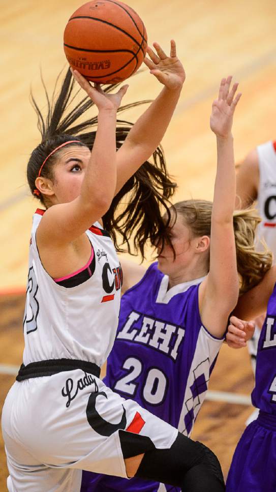 Trent Nelson  |  The Salt Lake Tribune
American Fork's Taylor Moeaki puts up a shot, with Lehi's Katy Peck defending, as American Fork hosts Lehi High School, girls' basketball in American Fork, Wednesday January 7, 2015.