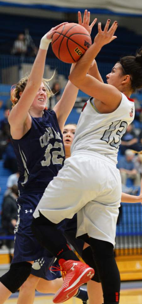 Steve Griffin  |  The Salt Lake Tribune

Copper Hills forward Ashley Larsen, left, blocks the shot of American Fork's Taylor Moeaki during opening round of the girl's 5A basketball state tournament at SLCC in Taylorsville, Monday, February 16, 2015.