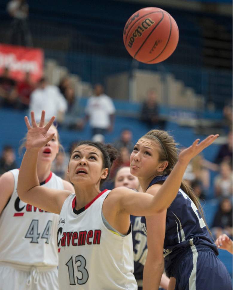 Steve Griffin  |  The Salt Lake Tribune

American Fork's Taylor Moeaki reaches back for the ball during game against Copper Hills during opening round of the girl's 5A basketball state tournament at SLCC in Salt Lake City, Monday, February 16, 2015.