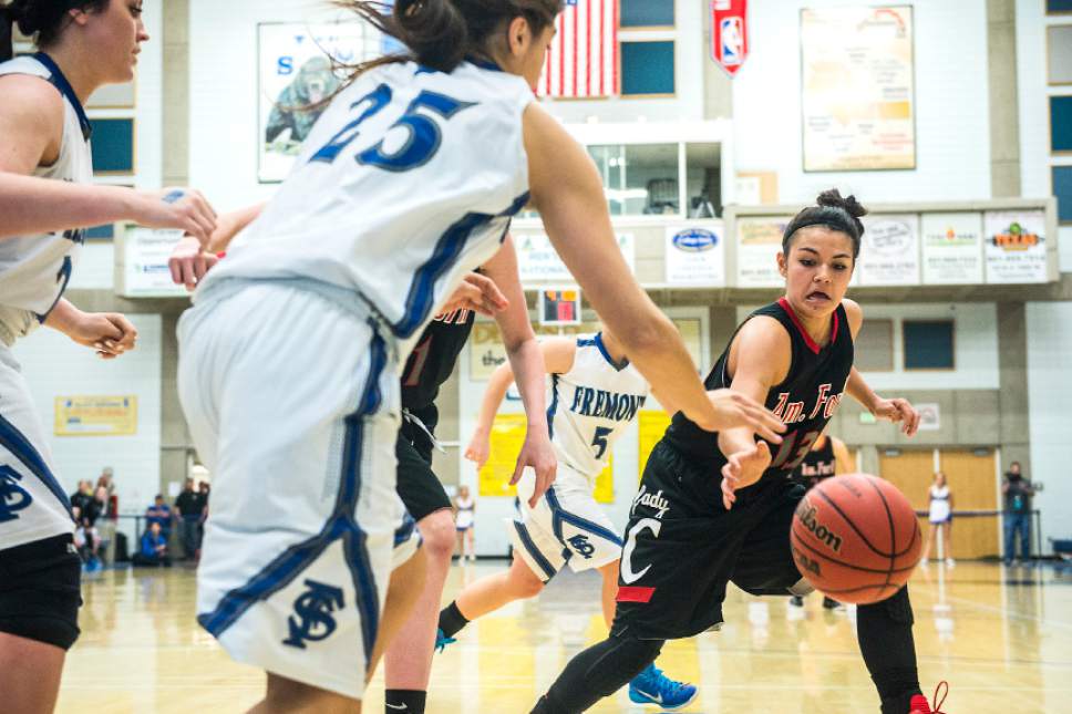 Chris Detrick  |  The Salt Lake Tribune
American Fork's Taylor Moeaki (13) and Fremont's Maryah Tipping (25) go for the ball during the game at Salt Lake Community College Lifetime Activities Center  Friday February 20, 2015. Fremont defeated American Fork 38-37.