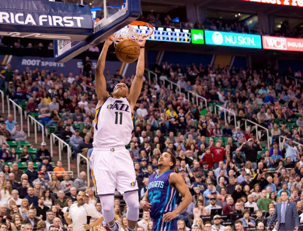 Lennie Mahler  |  The Salt Lake Tribune

Dante Exum dunks as he is followed by Charlotte's Brian Roberts in a game at Vivint Smart Home Arena on Saturday, Feb. 4, 2017.