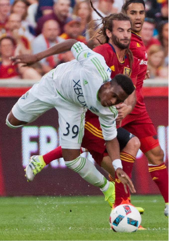Michael Mangum  |  Special to the Tribune

Real Salt Lake midfielder Kyle Beckerman (5) and Seattle Sounders forward Oalex Anderson collide during their match at Rio Tinto Stadium in Sandy, UT on Tuesday, June 28th, 2016.