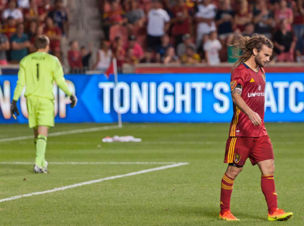 Michael Mangum  |  Special to the Tribune

Real Salt Lake midfielder Kyle Beckerman walks out of the 18-yard box following a blocked penalty kick by Seattle Sounders goalkeeper Tyler Miller, left, during their U.S. Open Cup match at Rio Tinto Stadium in Sandy, UT on Tuesday, June 28th, 2016. The match ended in a 1-1 draw with Seattle advancing after winning in a penalty kick shootout.