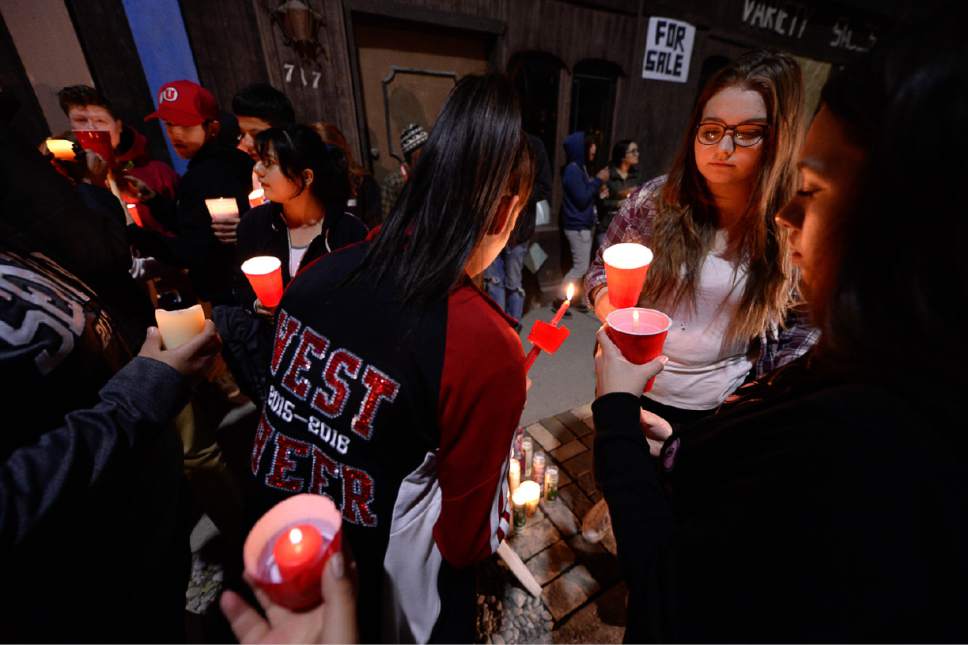 Francisco Kjolseth | The Salt Lake Tribune
Students from West High School gather for a candlelight vigil at the scene of a deadly car accident involving students from the school early Thursday morning. Two West High School seniors were killed and two others - another student and a pregnant woman were seriously injured in the head-on collision north of the school.