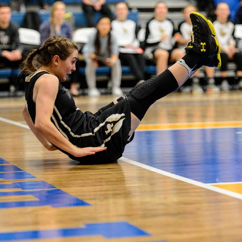 Trent Nelson  |  The Salt Lake Tribune
Lone Peak's Savannah Flanary (2) slides on the floor as Lone Peak faces Copper Hills in the 5A high school girls basketball state championships at Salt Lake Community College in Taylorsville, Wednesday February 22, 2017.