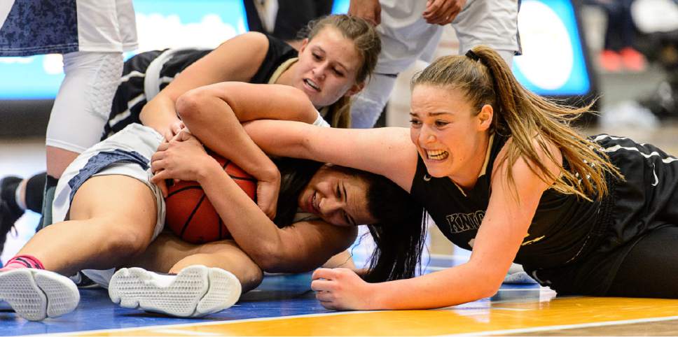 Trent Nelson  |  The Salt Lake Tribune
Copper Hills's Lenisi Fineanganofo (24) and Lone Peak's Emma Clark (35) tangle for the loose ball as Lone Peak faces Copper Hills in the 5A high school girls basketball state championships at Salt Lake Community College in Taylorsville, Wednesday February 22, 2017.