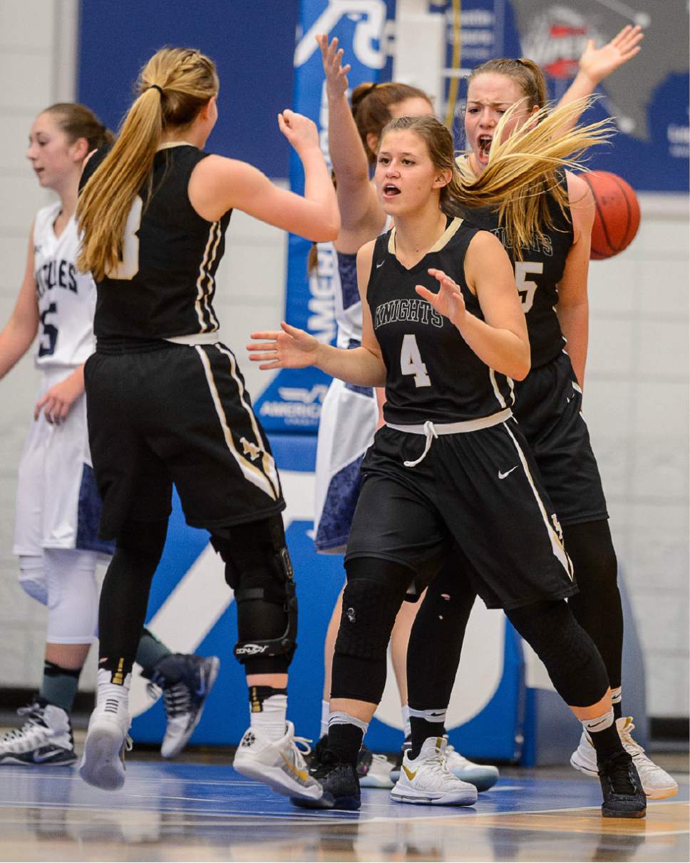 Trent Nelson  |  The Salt Lake Tribune
Lone Peak's Brooke Peterson (4) and teammates celebrate an early comeback as Lone Peak faces Copper Hills in the 5A high school girls basketball state championships at Salt Lake Community College in Taylorsville, Wednesday February 22, 2017.