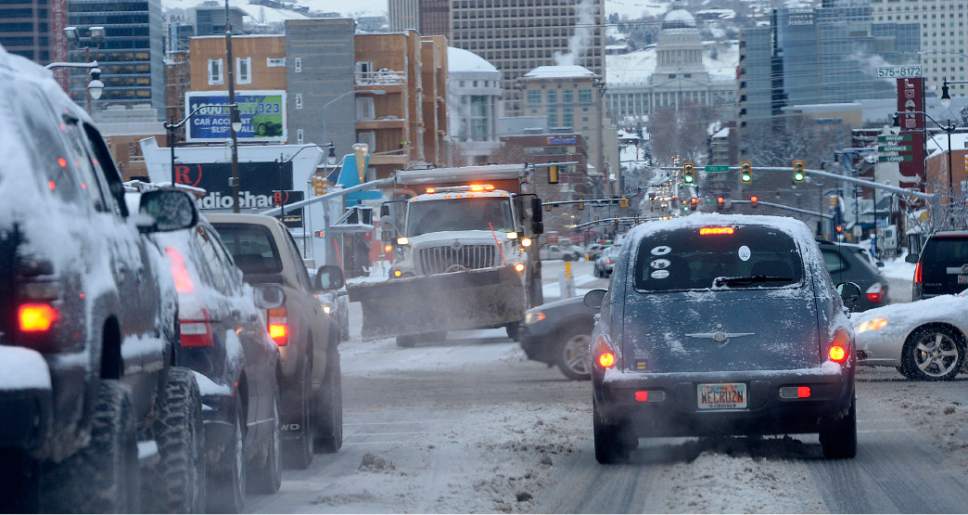 Al Hartmann  |  The Salt Lake Tribune
Drivers endure a slow and go commute on snow-packed streets in downtown Salt Lake City Thursday Jan. 5.