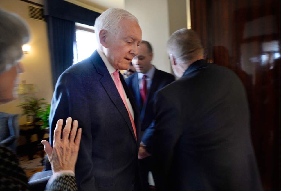 Scott Sommerdorf | The Salt Lake Tribune 
U.S. Senator Orrin Hatch, R-Utah, moves to enter the Utah Senate to speak after discussing the recent changes in immigration law coming from the White House with homeless advocate Pamela Atkinson, left, Wednesday, February 22, 2017.