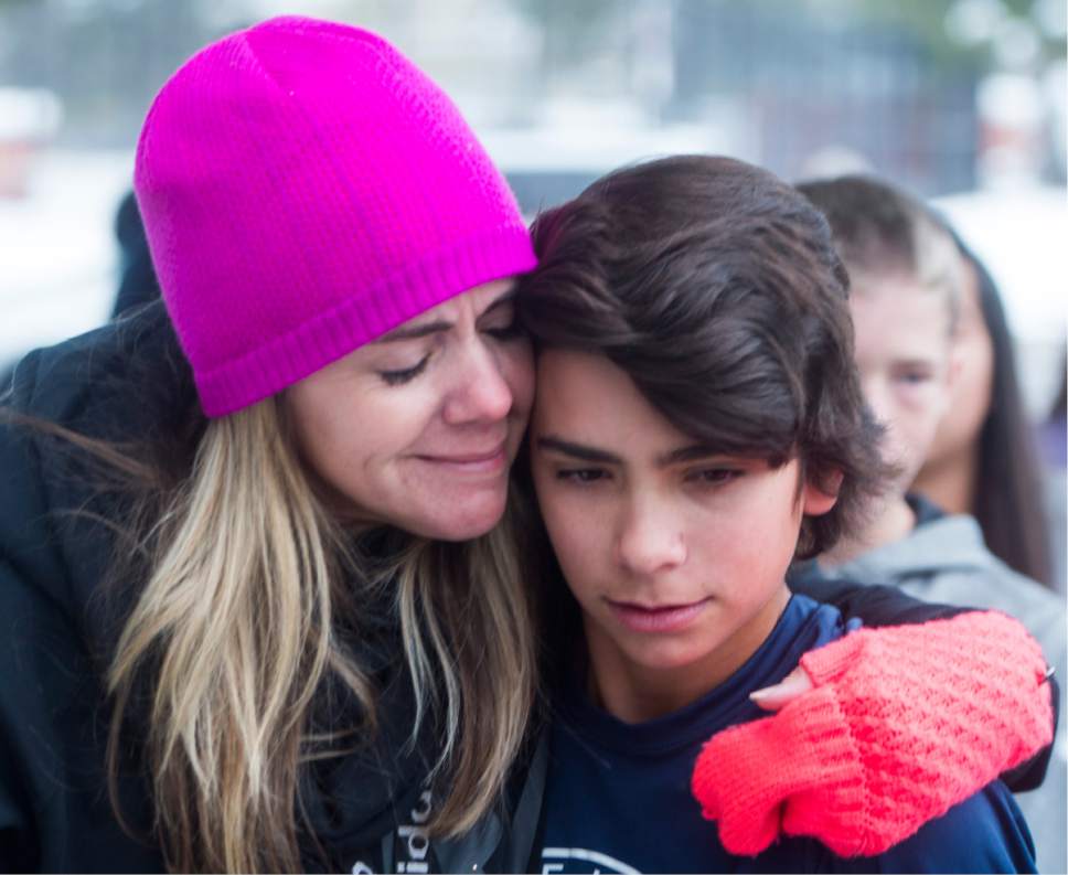 Rick Egan  |  The Salt Lake Tribune

Lori Malmrose hugs her son Boston, after a shooting at Mueller Park Jr High, in Bountiful, Thursday, December 1, 2016.