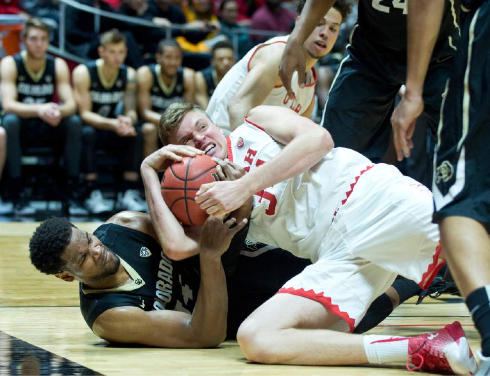 Lennie Mahler  |  The Salt Lake Tribune

Utah center Jayce Johnson gets tied up for a jump ball with Colorado's   Tory Miller in the first half of a game against the Colorado Buffaloes on Sunday, Jan. 1, 2017, at the Huntsman Center in Salt Lake City.