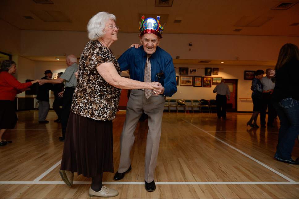 Francisco Kjolseth | The Salt Lake Tribune
Carol Miller, 81, takes a spin on the dance floor with Karl Tinggaard as he celebrates his 103 birthday by doing what he does every week, dancing at the Heritage Center in Murray on Thursday, February 23, 2017.