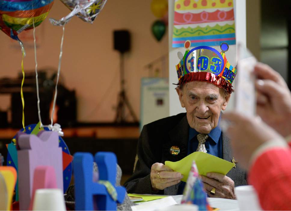 Francisco Kjolseth | The Salt Lake Tribune
Opening cards and presents, Karl Tinggaard celebrates his 103 birthday by doing what he does every week, dancing at the Heritage Center in Murray on Thursday, February 23, 2017.