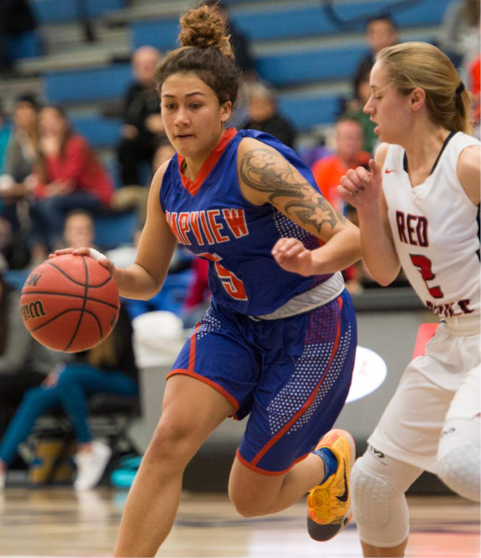 Rick Egan  |  The Salt Lake Tribune

Timpview Thunderbirds Sierra Neves (5) is guarded by Springville Red Devils Kami Warner (2), in 4A State playoff action, at SLCC, Thursday, February 23, 2017.