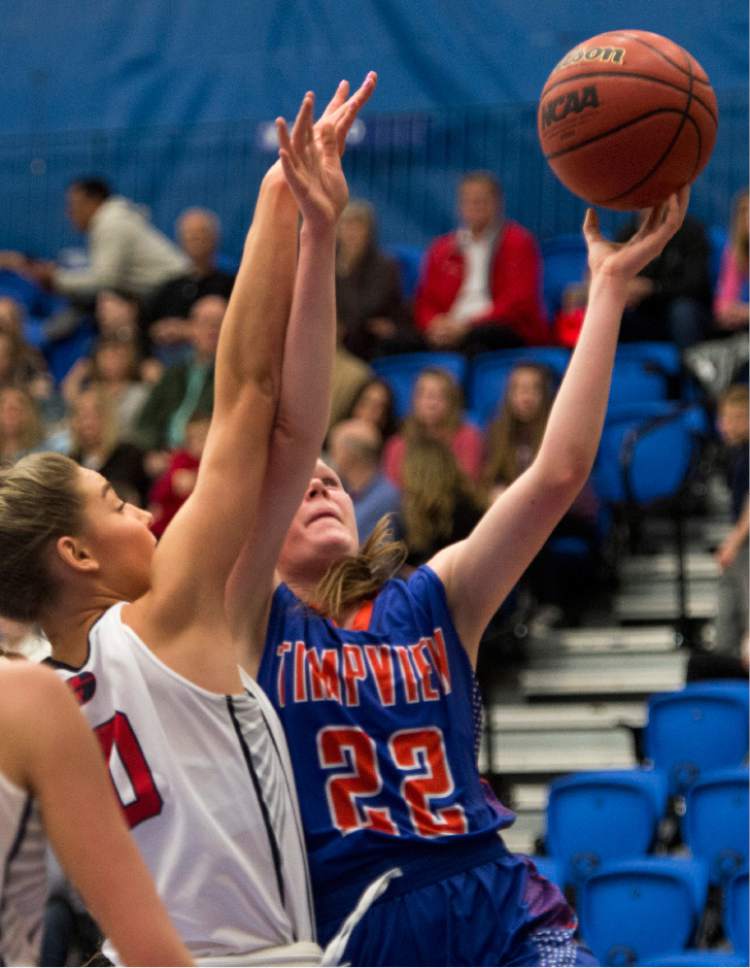 Rick Egan  |  The Salt Lake Tribune

Timpview Thunderbirds Hannah Glazier (22) shoots over Springville Red Devils Savannah Sumsion (10) in 4A State playoff action, at SLCC, Thursday, February 23, 2017.