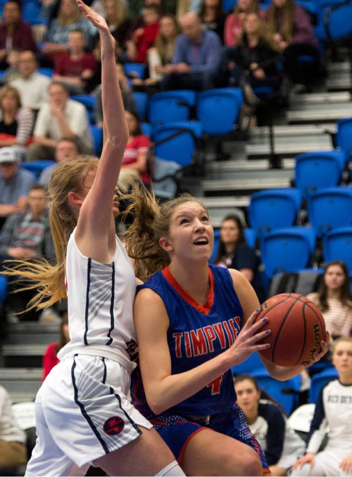 Rick Egan  |  The Salt Lake Tribune

Timpview Thunderbirds Ella Pope (4) gets past Springville Red Devils Cheyanne Brown (21), in 4A State playoff action, at SLCC, Thursday, February 23, 2017.