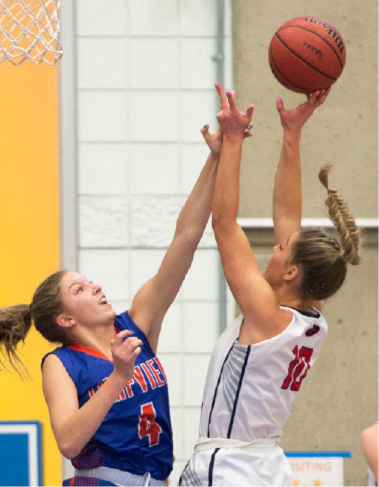 Rick Egan  |  The Salt Lake Tribune

Springville Red Devils Savannah Sumsion (10) shoots over Timpview Thunderbirds Ella Pope (4), in 4A State playoff action, at SLCC, Thursday, February 23, 2017.