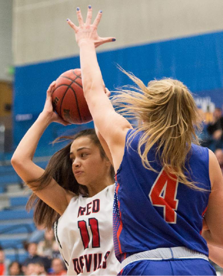 Rick Egan  |  The Salt Lake Tribune

Springville Red Devils Kallysta Strong (11) grabs a rebound fromTimpview Thunderbirds Ella Pope (4), in 4A State playoff action, at SLCC, Thursday, February 23, 2017.