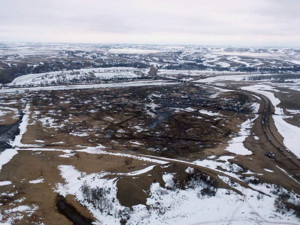 This aerial photo provided the Morton County Sheriff Department shows the closed Dakota Access pipeline protest camp near Cannon Ball, N.D., Thursday, Feb. 23, 2017.  Authorities on Thursday cleared the camp where opponents of the pipeline had gathered for the better part of a year, searching tents and huts and arresting dozens of holdouts who had defied a government order to leave. (Morton County Sheriff Department via AP)