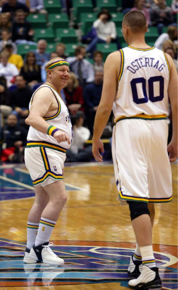 Tribune file photo

Utah Jazz owner Larry Miller, left, sports a retro-Jazz uniform as he jokes with Jazz center Greg Ostertag, right, just before tipoff against the Miami Heat Thursday, Jan. 15, 2004, in Salt Lake City. The Jazz celebrated the 25th anniversary of being in Utah by wearing retro-uniforms from 1979.