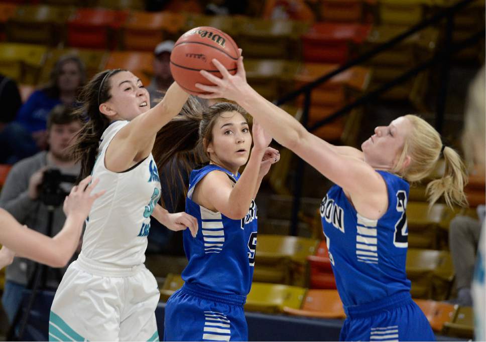 Scott Sommerdorf | The Salt Lake Tribune 
Juan Diego's Anna Ewoniuk, left, battles with Carbon's Cyene Bigelow, and Taylor Passarella, right during first half play. Juan Diego beat Carbon 53-50 in a Girl's 3A playoff played at USU, Friday, February 24, 2017.