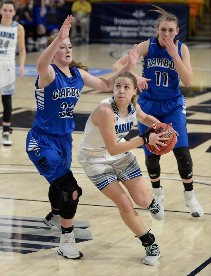 Scott Sommerdorf | The Salt Lake Tribune 
Juan Diego's Rebecca Curran drives against McKenna Sorenson during second half play. Juan Diego beat Carbon 53-50 in a Girl's 3A playoff played at USU, Friday, February 24, 2017.