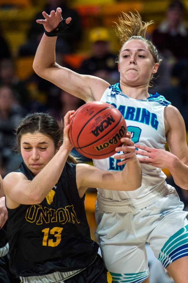 Chris Detrick  |  The Salt Lake Tribune
Juan Diego's Rebecca Curran (12) fouls Union's Marleigh Horrocks (13) during the 3A playoff basketball game at Dee Glen Smith Spectrum in Logan Thursday February 23, 2017.