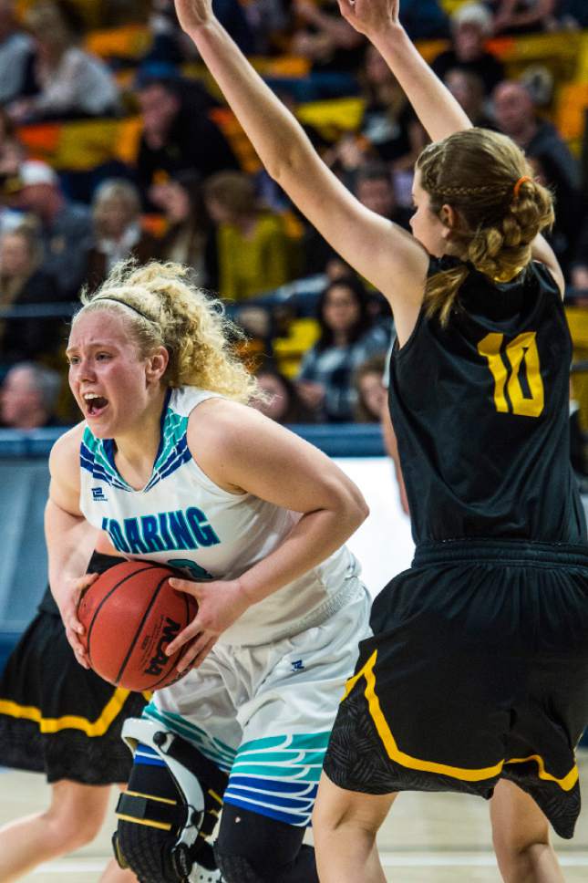 Chris Detrick  |  The Salt Lake Tribune
Juan Diego's Brie Veltri (13) grabs a rebound past Union's Kennedy Ross (10) during the 3A playoff basketball game at Dee Glen Smith Spectrum in Logan Thursday February 23, 2017.